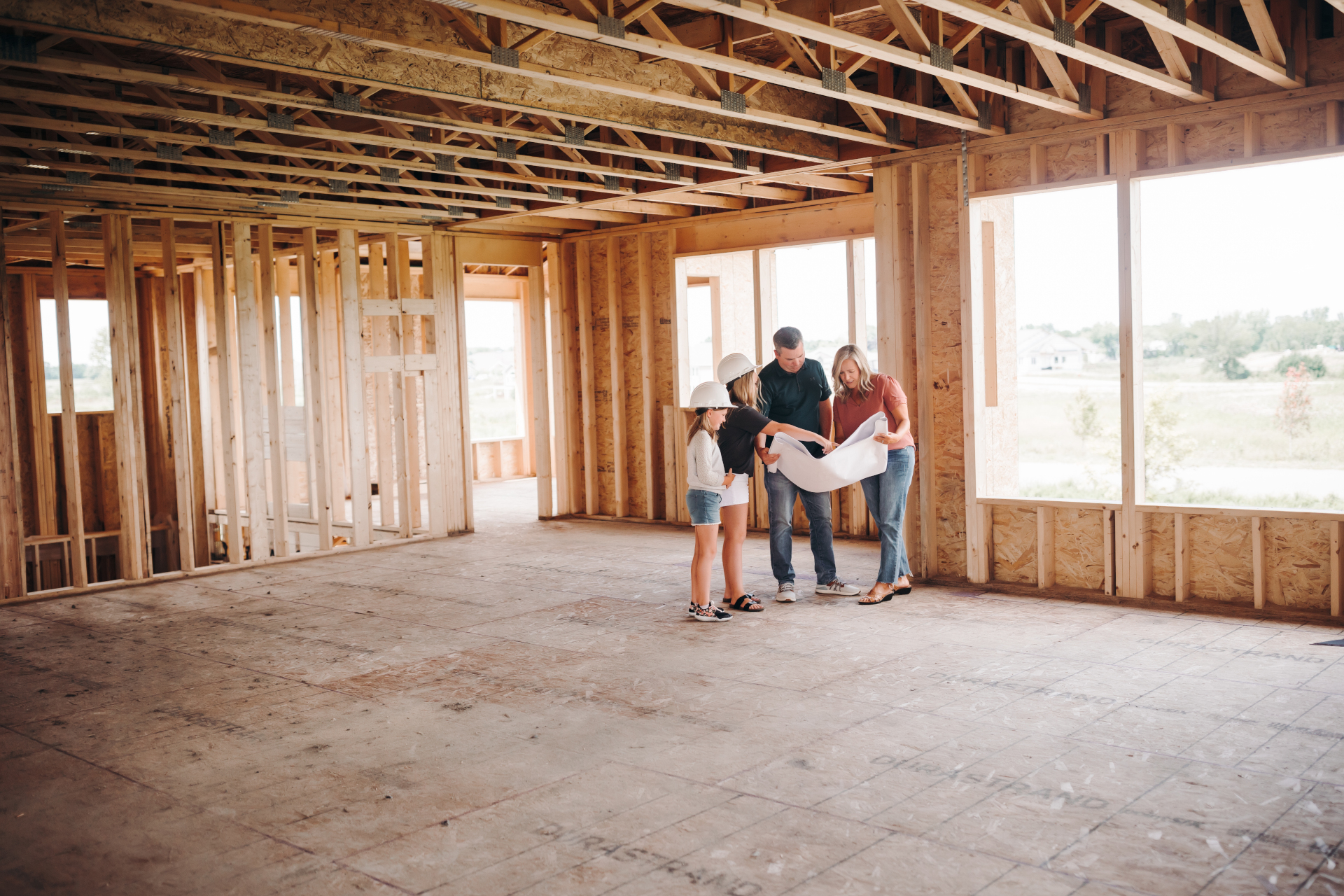 Family looking at home plans
