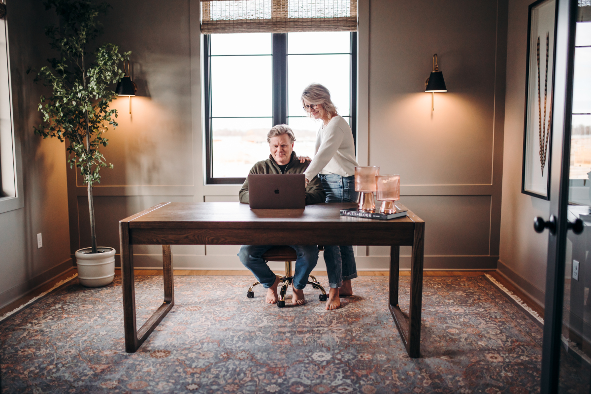 Couple at a desk in home study