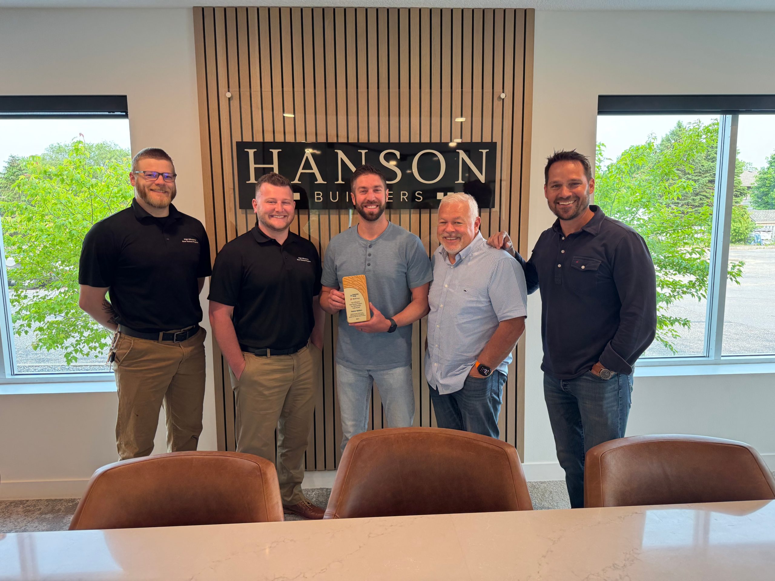 The Hanson Builders team with their award for energy efficient homes.